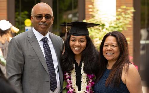 A picture of a family with the graduate student.